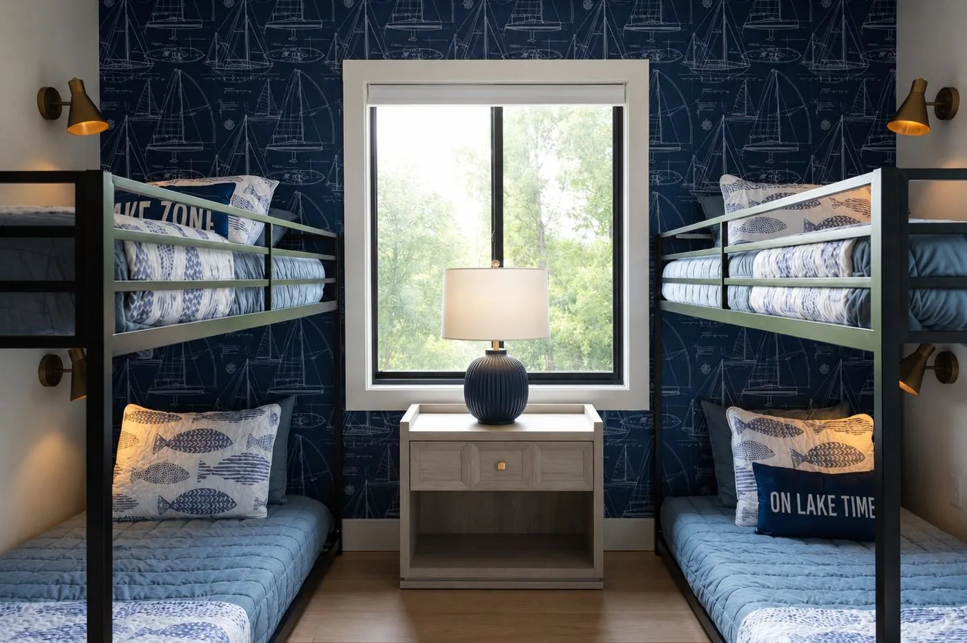 Bunk-bed bedroom with window and nautical wallpaper