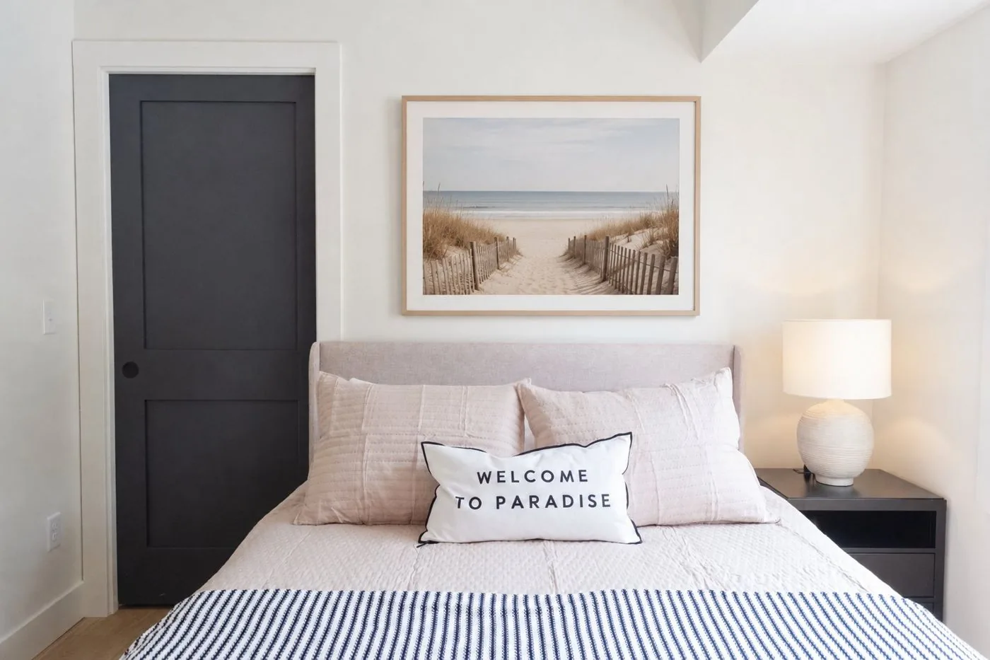 Guest bedroom with beach art